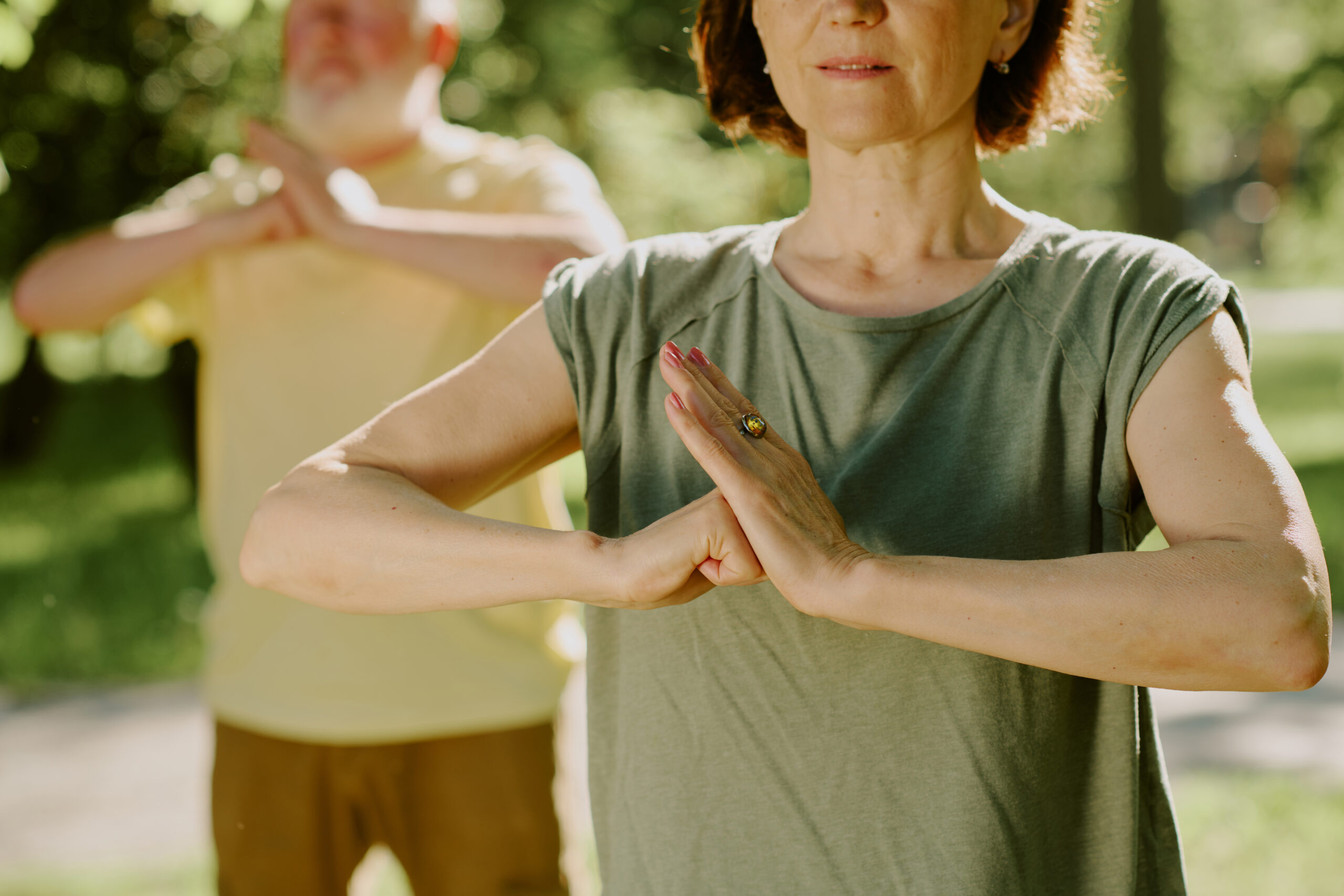 toned arms of senior woman in position